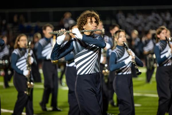 Summit High band members march